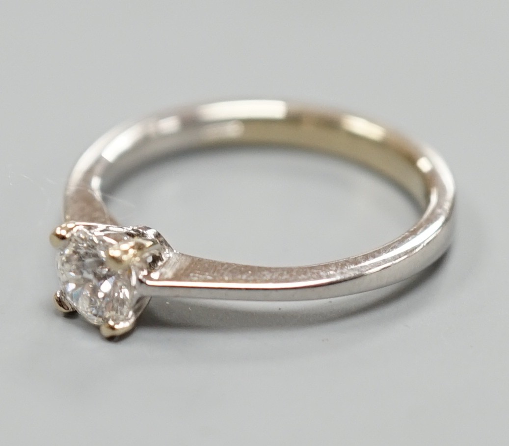 A modern Italian 750 white metal and solitaire diamond ring, size L/M, gross weight 2.8 grams.